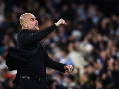 Manchester City's Spanish manager Pep Guardiola celebrates following his team first goal scored by Manchester City's Belgian midfielder #17 Kevin De Bruyne during the UEFA Champions League quarter-final second-leg football match between Manchester City and Real Madrid, at the Etihad Stadium, in Manchester, north-west England, on April 17, 2024. (Photo by Darren Staples / AFP)