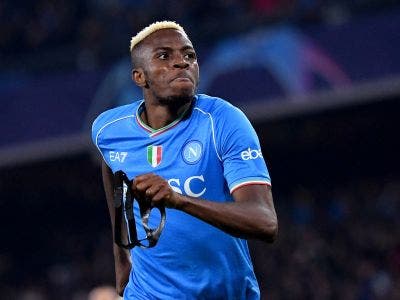 Napoli's Nigerian forward #09 Victor Osimhen celebrates after scoring a goal during the UEFA Champions League round of 16 first Leg football match between Napoli and Barcelona at the Diego-Armando-Maradona stadium in Naples on February 21, 2024. (Photo by Tiziana FABI / AFP)