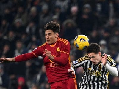 Juventus Turkish forward #15 Kenan Yildiz (R) and Roma's Argentine forward #21 Paulo Dybala (L) fight for the ball during the Italian Serie A football match between Juventus and Roma at the Allianz Stadium in Turin, on December 30, 2023. (Photo by Isabella BONOTTO / AFP)