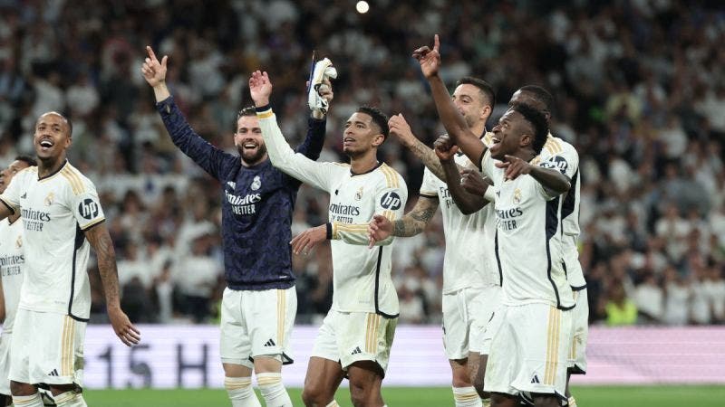 Real Madrid's players celebrate their victory at the end of the Spanish league football match between Real Madrid CF and FC Barcelona at the Santiago Bernabeu stadium in Madrid on April 21, 2024. (Photo by Thomas COEX / AFP)